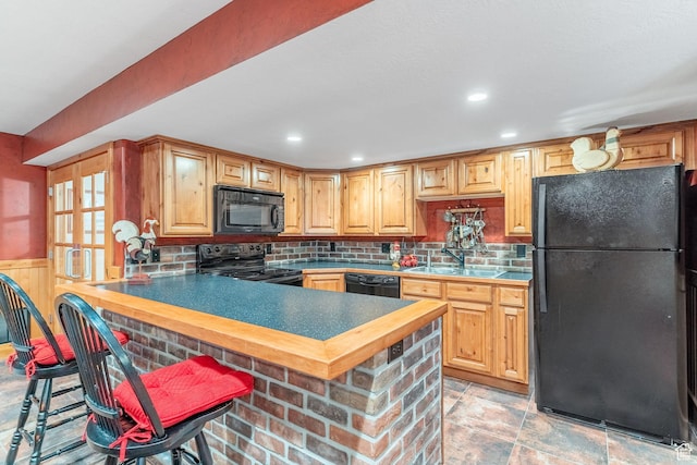 250 E 950 N, Kaysville, UT 84037 - kitchen with black appliances, a sink, decorative backsplash, light stone finish floors, and a peninsula