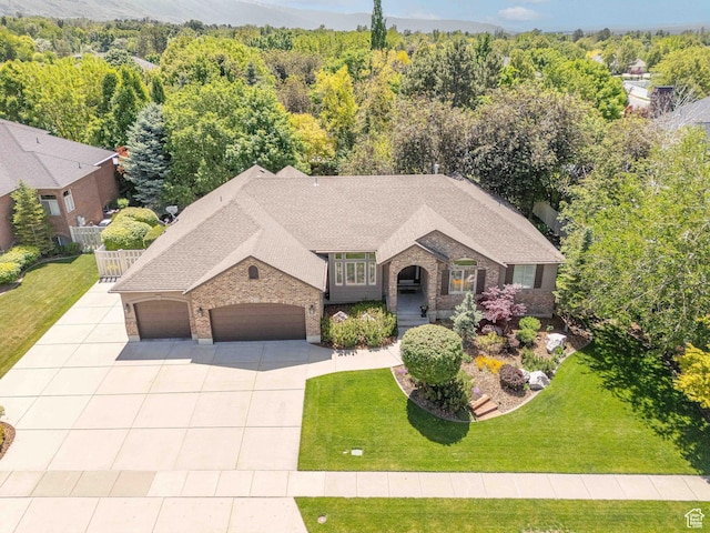 250 E 950 N, Kaysville, UT 84037 - view of front facade with an attached garage, concrete driveway, brick siding, and roof with shingles