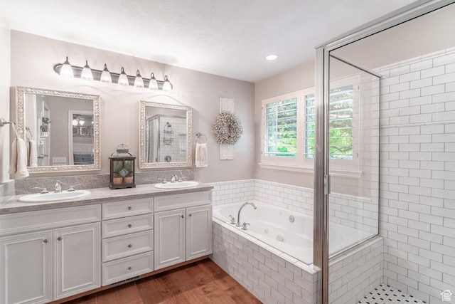 250 E 950 N, Kaysville, UT 84037 - full bathroom featuring a stall shower, a tub with jets, double vanity, and wood finished floors