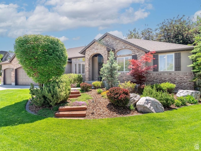 250 E 950 N, Kaysville, UT 84037 - french country home with brick siding, a front lawn, an attached garage, and driveway