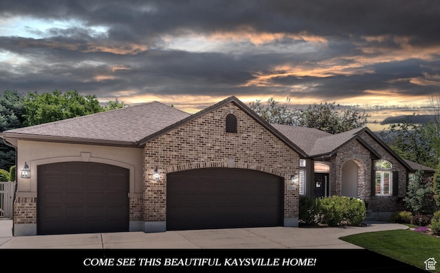 250 E 950 N, Kaysville, UT 84037 - french country inspired facade with an attached garage, brick siding, driveway, and roof with shingles