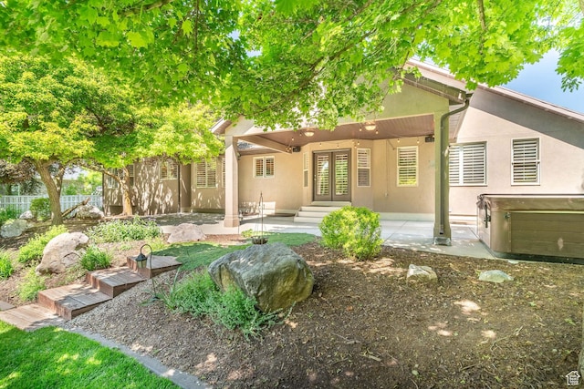 250 E 950 N, Kaysville, UT 84037 - rear view of property with french doors, stucco siding, a patio, and a hot tub