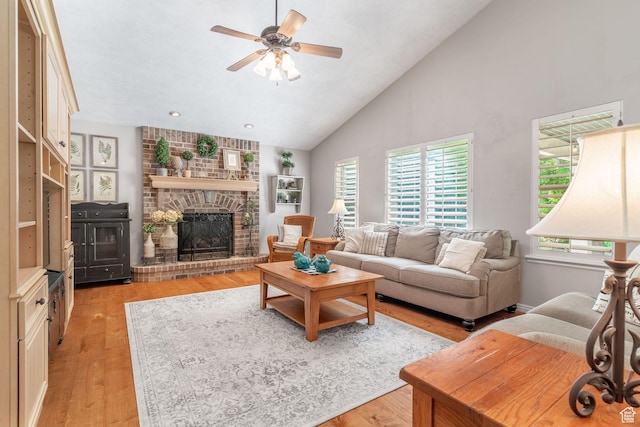 250 E 950 N, Kaysville, UT 84037 - living room featuring light wood-style flooring, a ceiling fan, a brick fireplace, high vaulted ceiling, and recessed lighting