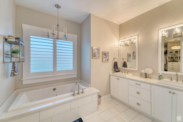 3207 W 2650 S, Hurricane, UT 84737 - full bathroom featuring a chandelier, tile patterned flooring, double vanity, a jetted tub, and a textured ceiling