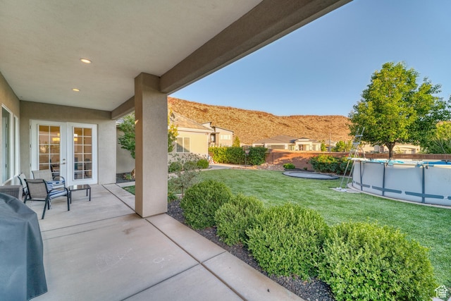 3207 W 2650 S, Hurricane, UT 84737 - view of yard featuring a mountain view, french doors, and a patio