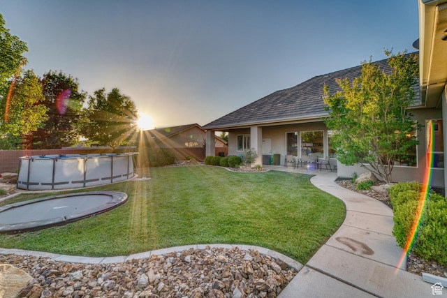 3207 W 2650 S, Hurricane, UT 84737 - view of green lawn featuring a covered pool and a patio