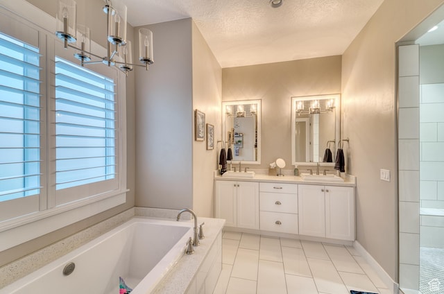 3207 W 2650 S, Hurricane, UT 84737 - full bathroom with a garden tub, double vanity, a textured ceiling, and tile patterned floors