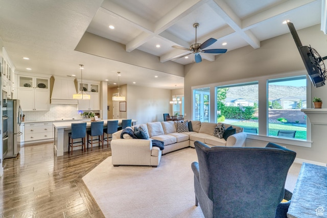 3207 W 2650 S, Hurricane, UT 84737 - living area featuring coffered ceiling, recessed lighting, a ceiling fan, beam ceiling, and light wood-type flooring