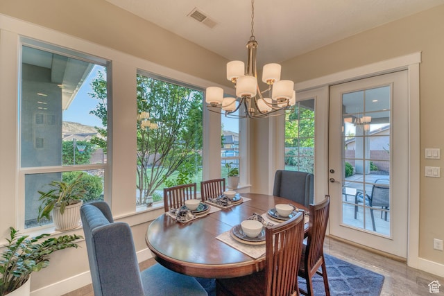 3207 W 2650 S, Hurricane, UT 84737 - dining space with a chandelier, wood finished floors, and baseboards