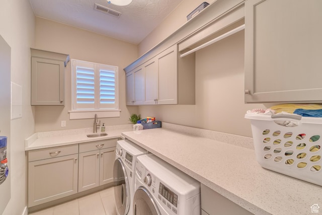 3207 W 2650 S, Hurricane, UT 84737 - laundry room with independent washer and dryer, cabinet space, light tile patterned floors, and a textured ceiling