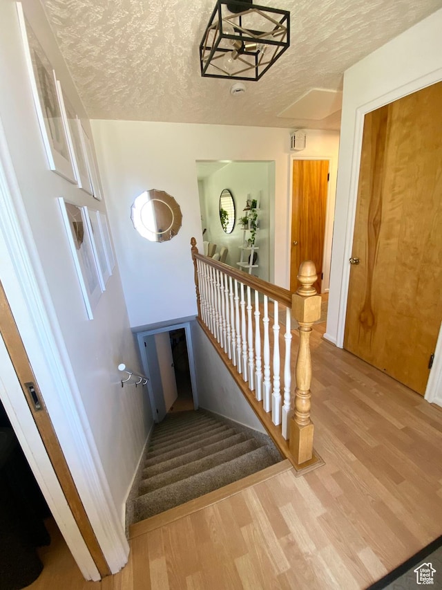 1321 Darling St, Ogden, UT 84403 - stairway featuring wood finished floors and a textured ceiling