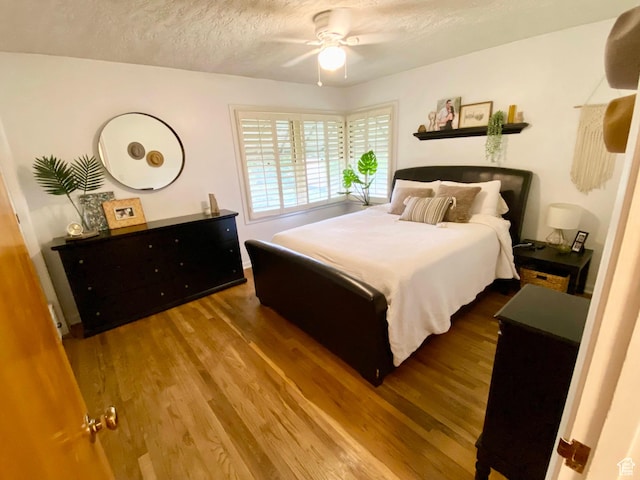 1321 Darling St, Ogden, UT 84403 - bedroom with wood finished floors, a textured ceiling, and ceiling fan