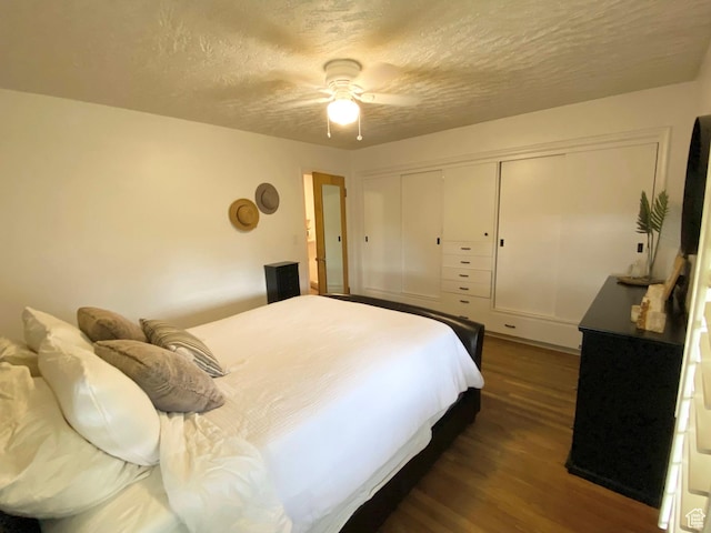 1321 Darling St, Ogden, UT 84403 - bedroom featuring dark wood-type flooring, a textured ceiling, a closet, and ceiling fan