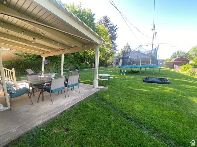 1321 Darling St, Ogden, UT 84403 - view of yard featuring a trampoline, a patio, and outdoor dining space
