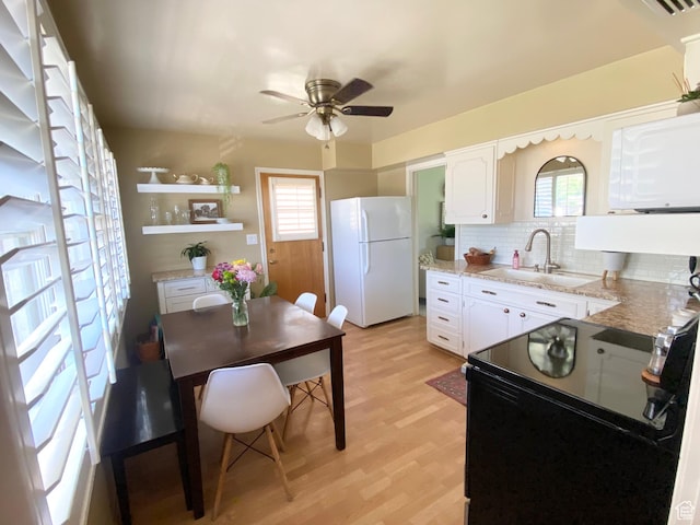 1321 Darling St, Ogden, UT 84403 - kitchen with white appliances, a sink, a ceiling fan, and plenty of natural light
