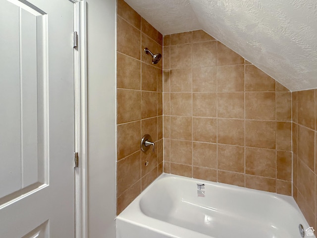 346 Columbia Dr, East Carbon, UT 84520 - bathroom with a textured ceiling, lofted ceiling, and bathing tub / shower combination
