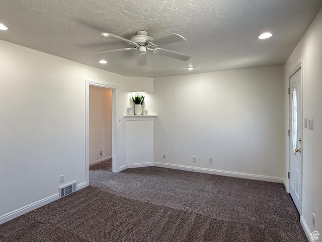 346 Columbia Dr, East Carbon, UT 84520 - unfurnished room featuring dark carpet, recessed lighting, a ceiling fan, baseboards, and a textured ceiling