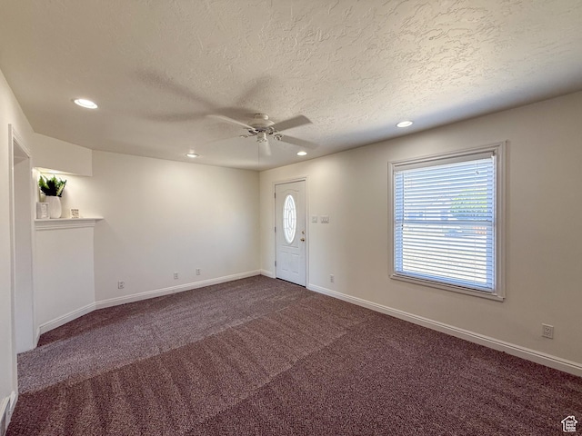 346 Columbia Dr, East Carbon, UT 84520 - entrance foyer featuring a ceiling fan, recessed lighting, a textured ceiling, dark carpet, and baseboards