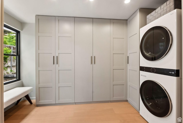 2655 E Hiawatha Cir, Salt Lake City, UT 84108 - laundry room featuring estacked washer and dryer, light wood finished floors, and recessed lighting