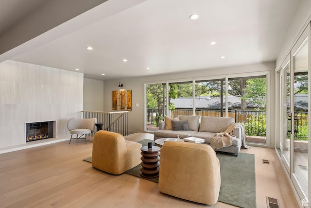 2655 E Hiawatha Cir, Salt Lake City, UT 84108 - living room with wood finished floors, recessed lighting, and a lit fireplace
