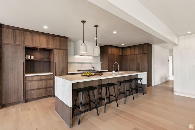 2655 E Hiawatha Cir, Salt Lake City, UT 84108 - kitchen featuring modern cabinets, light wood-type flooring, light countertops, open shelves, and recessed lighting