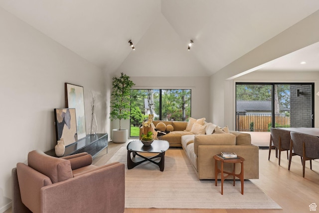 2655 E Hiawatha Cir, Salt Lake City, UT 84108 - living area featuring light wood-style flooring and high vaulted ceiling