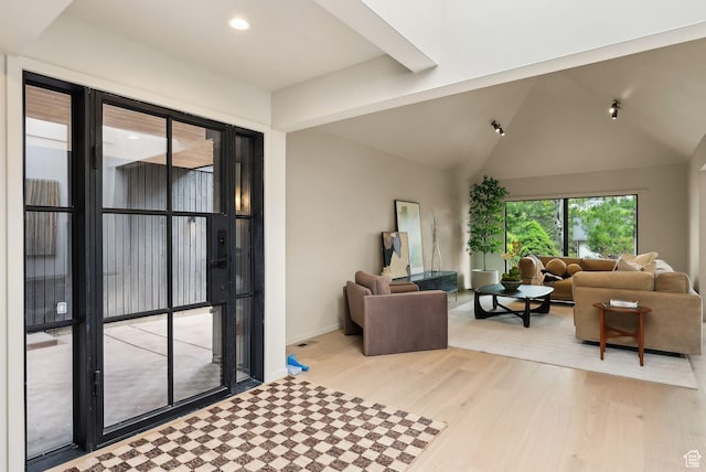 2655 E Hiawatha Cir, Salt Lake City, UT 84108 - living area with light wood-style flooring, baseboards, recessed lighting, and vaulted ceiling