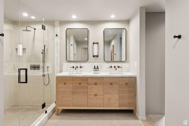 2655 E Hiawatha Cir, Salt Lake City, UT 84108 - bathroom with double vanity, a shower stall, recessed lighting, and baseboards