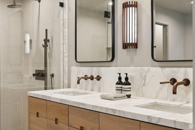 2655 E Hiawatha Cir, Salt Lake City, UT 84108 - full bathroom featuring double vanity, tiled shower, and decorative backsplash