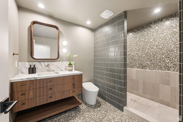 2655 E Hiawatha Cir, Salt Lake City, UT 84108 - bathroom with toilet, vanity, a walk in shower, tile walls, and recessed lighting