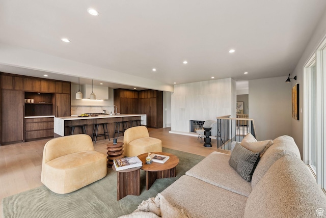 2655 E Hiawatha Cir, Salt Lake City, UT 84108 - living area with light wood-style floors, recessed lighting, and bar