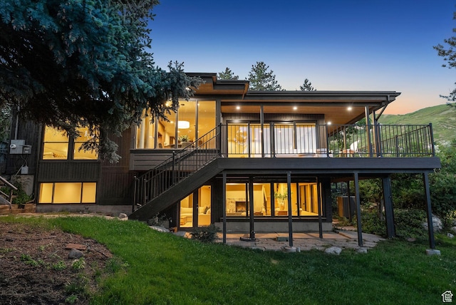 2655 E Hiawatha Cir, Salt Lake City, UT 84108 - rear view of property with stairs, a wooden deck, a yard, and a patio area