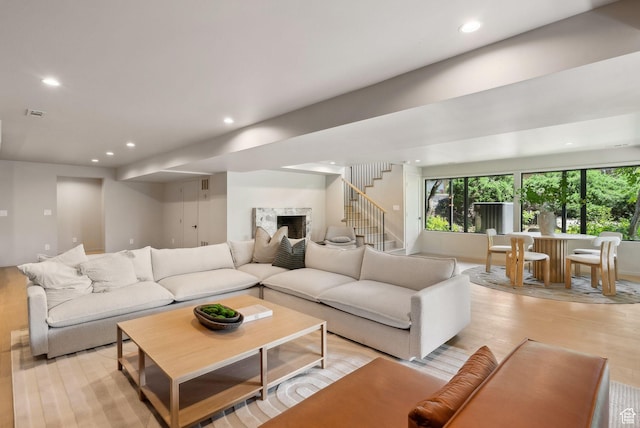 2655 E Hiawatha Cir, Salt Lake City, UT 84108 - living area with recessed lighting, light wood-type flooring, stairway, and a fireplace