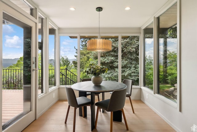 2655 E Hiawatha Cir, Salt Lake City, UT 84108 - sunroom featuring plenty of natural light, wood finished floors, baseboards, a mountain view, and recessed lighting