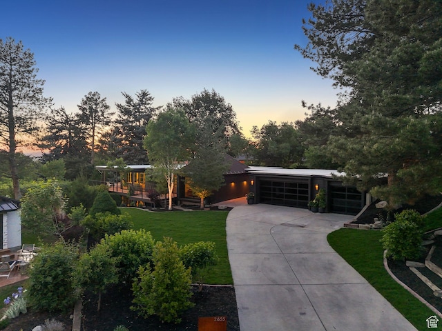 2655 E Hiawatha Cir, Salt Lake City, UT 84108 - view of front of property with concrete driveway, a front yard, and a garage