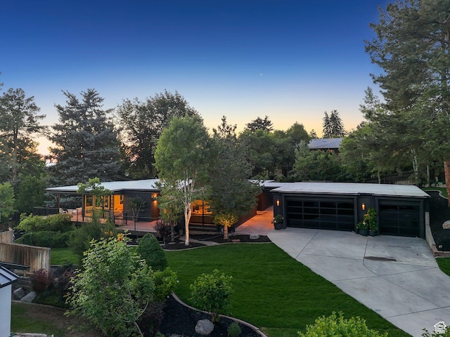 2655 E Hiawatha Cir, Salt Lake City, UT 84108 - yard at dusk with a yard and concrete driveway