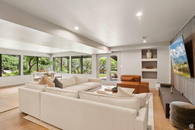 2655 E Hiawatha Cir, Salt Lake City, UT 84108 - living room featuring plenty of natural light, recessed lighting, light wood-style floors, and built in shelves