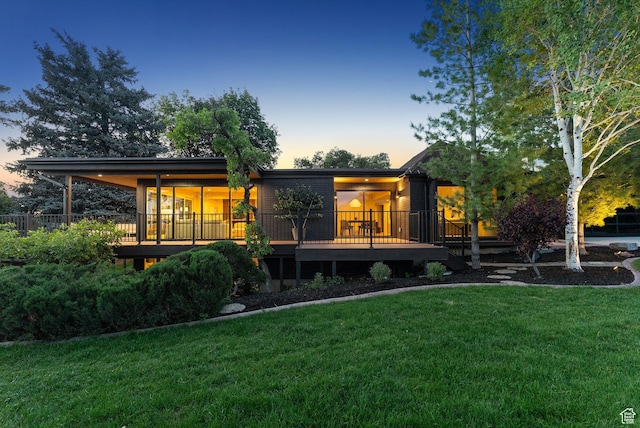 2655 E Hiawatha Cir, Salt Lake City, UT 84108 - rear view of house featuring a lawn and a wooden deck