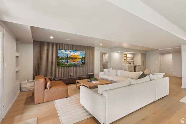 2655 E Hiawatha Cir, Salt Lake City, UT 84108 - living room featuring light wood-style floors, recessed lighting, baseboards, and built in shelves