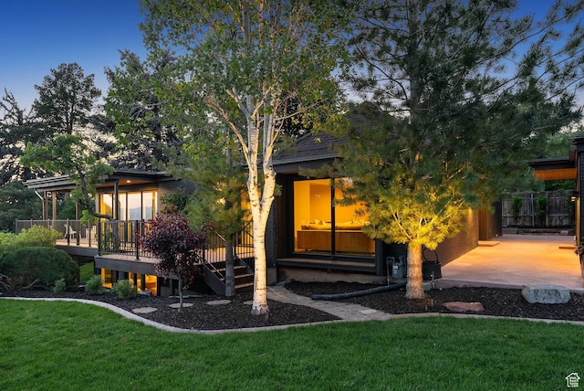 2655 E Hiawatha Cir, Salt Lake City, UT 84108 - rear view of house featuring a wooden deck and a yard