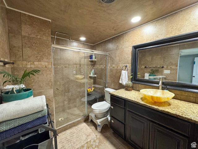 1204 S Redwood Dr, Salt Lake City, UT 84104 - bathroom featuring tile walls, vanity, a shower stall, toilet, and recessed lighting