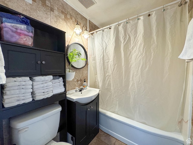 1204 S Redwood Dr, Salt Lake City, UT 84104 - bathroom with vanity, shower / bath combo with shower curtain, toilet, and tile patterned flooring