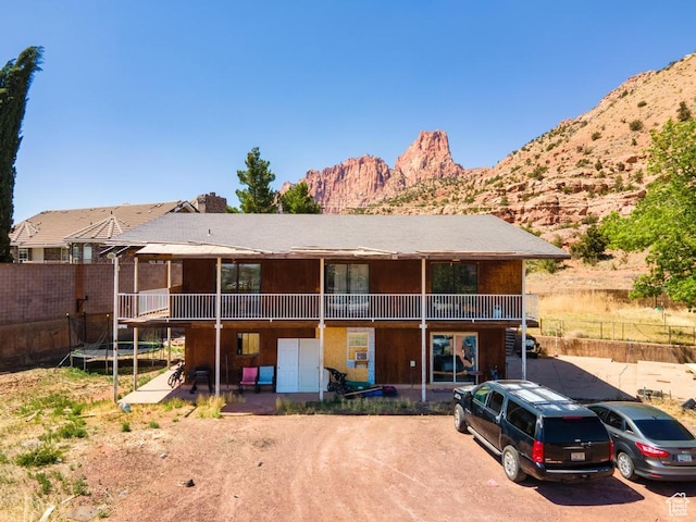 785 N Lauritzen St, Hildale, UT 84784 - back of property with a trampoline and a mountain view