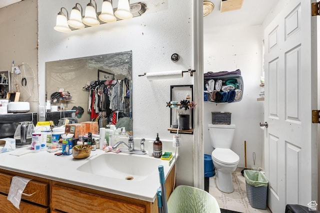 785 N Lauritzen St, Hildale, UT 84784 - bathroom with vanity, toilet, and a closet