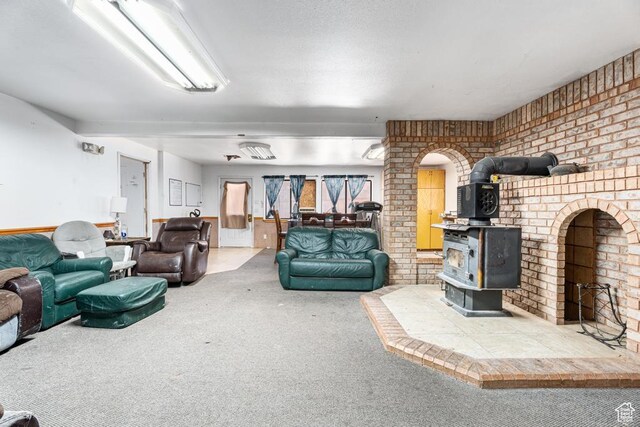 785 N Lauritzen St, Hildale, UT 84784 - carpeted living room with a wood stove and brick wall