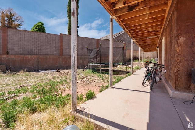 785 N Lauritzen St, Hildale, UT 84784 - fenced backyard with a patio and a trampoline