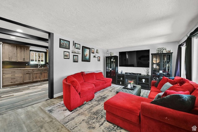 2195 W 4250 S, Roy, UT 84067 - living area with a textured ceiling, light wood-style floors, baseboards, and recessed lighting