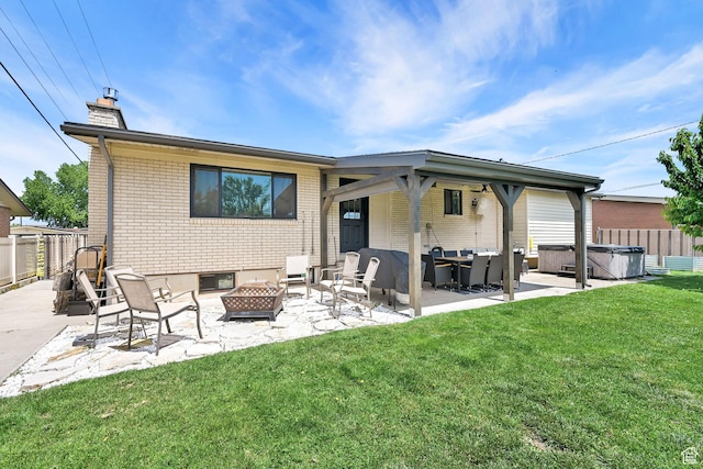 2195 W 4250 S, Roy, UT 84067 - rear view of house featuring a hot tub, a chimney, an outdoor living space with a fire pit, and a patio area