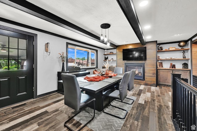 2195 W 4250 S, Roy, UT 84067 - dining area with beam ceiling, dark wood-type flooring, healthy amount of natural light, baseboards, and a textured ceiling