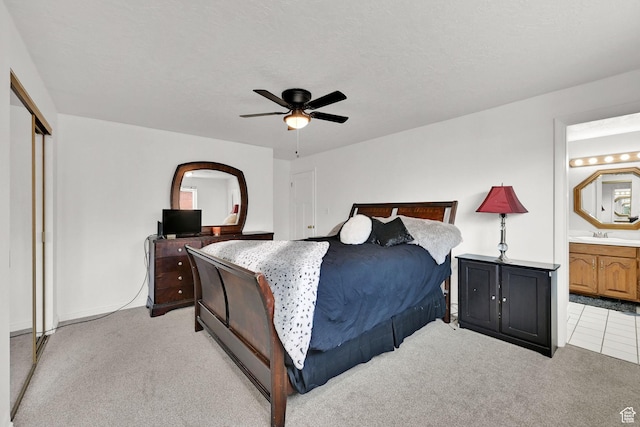 2195 W 4250 S, Roy, UT 84067 - bedroom with light carpet, connected bathroom, a ceiling fan, and a closet